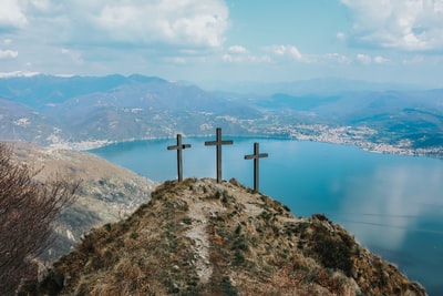 The top of the mountain has three wooden cross

